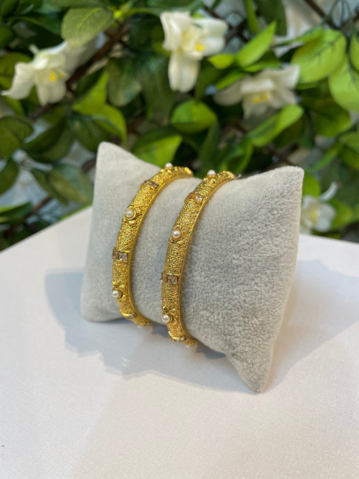 Gold and pearl bangles